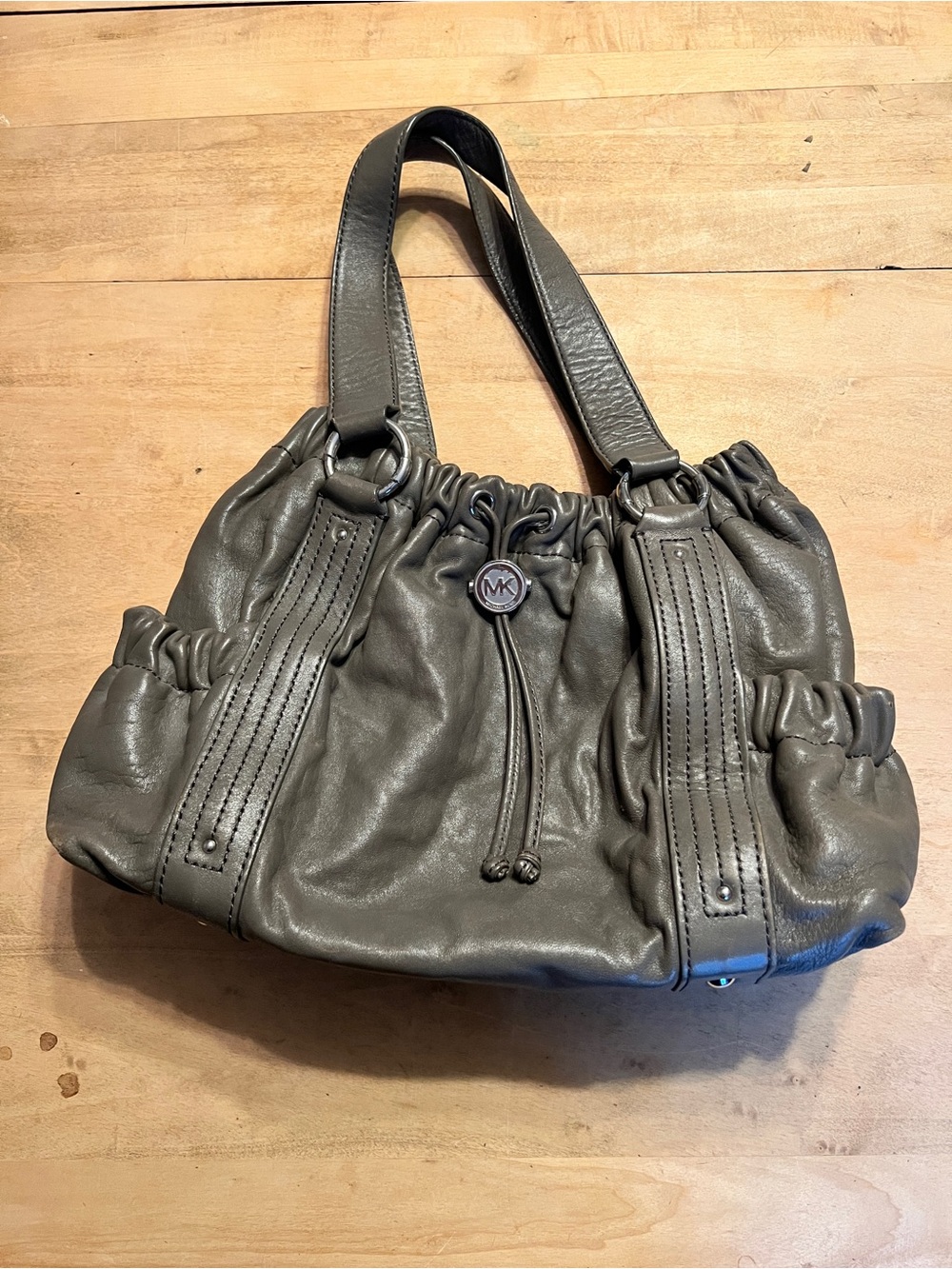 Michael Kors Jet Set Grey Leather Drawstring Shoulder Bag with MK Medallion